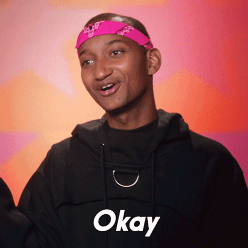 Young Man In Pink Headband And Black Hoodie Says Okay GIF