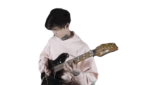 Young Man in Pink Hoodie Playing Guitar
