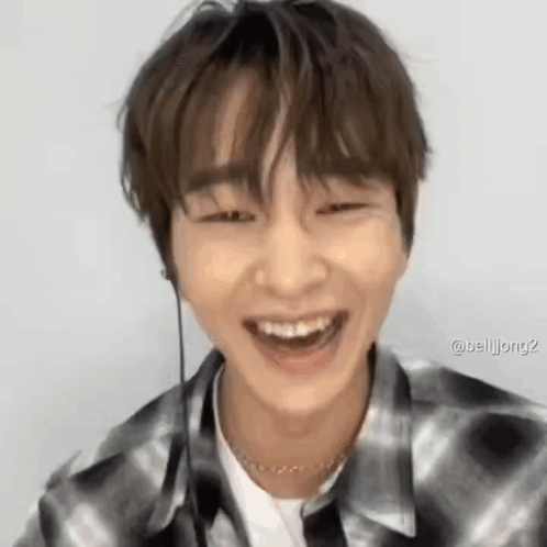 Young Man In Plaid Shirt Laughing GIF