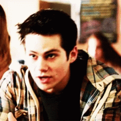 Young Man in Plaid Shirt Talking to Another Man
