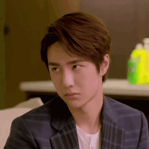 Young Man In Plaid Suit Looking GIF