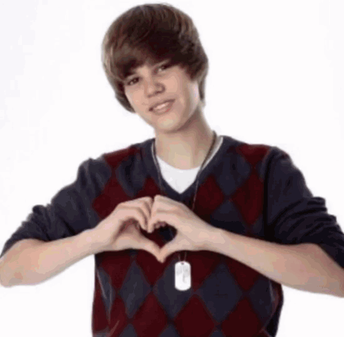 Young Man In Plaid Sweater Making Heart GIF