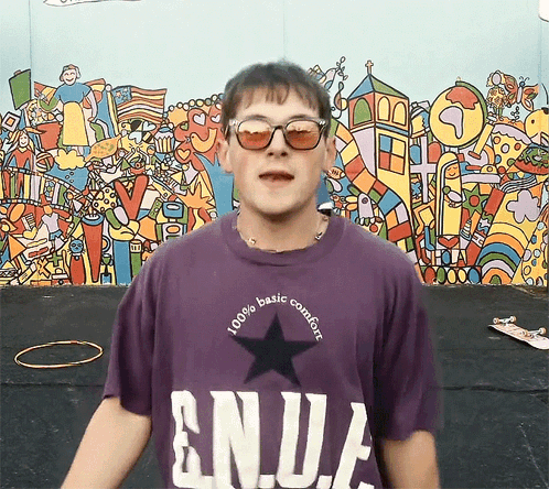 Young Man In Purple Enja Shirt With Sunglasses GIF