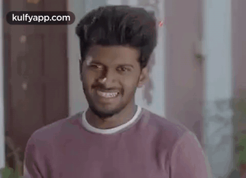 Young Man in Purple Shirt Smiling