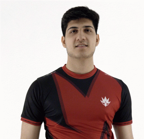 Young Man in Red and Black Shirt With White Leaf