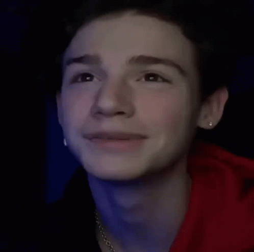 Young Man in Red Hoodie With Earrings