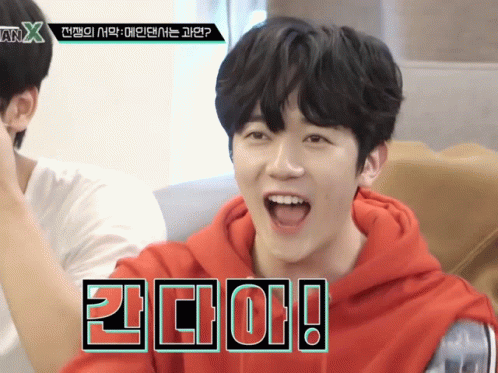 Young Man in Red Hoodie with X