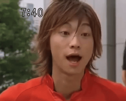 Young Man in Red Jacket Making Funny Face
