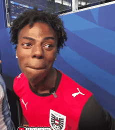 Young Man in Red Puma Shirt Making Face