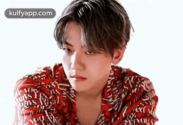Young Man In Red Shirt Looking Serious GIF