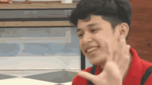 Young Man In Red Shirt Smiling Peace Sign GIF