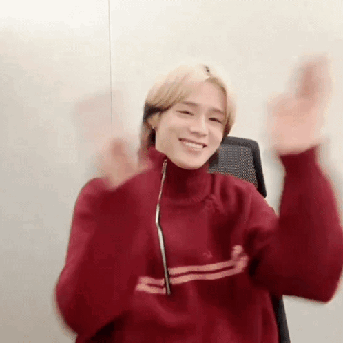 Young Man In Red Sweater Making Funny Face GIF