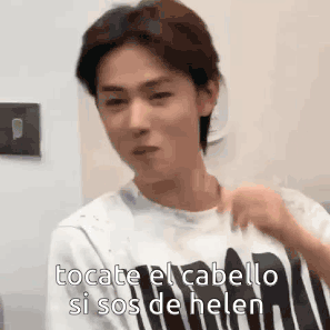 Young Man In Striped Shirt Talking Spanish GIF