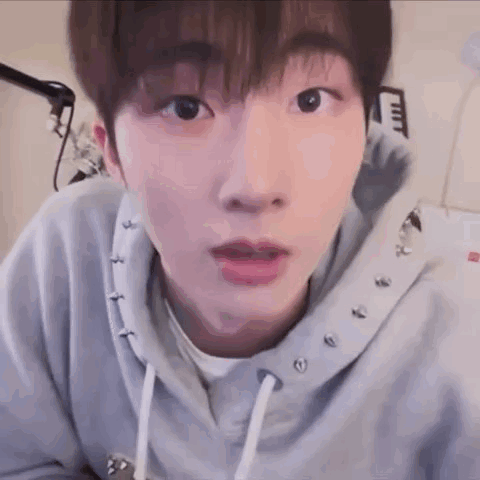 Young Man In Studded Hoodie GIF