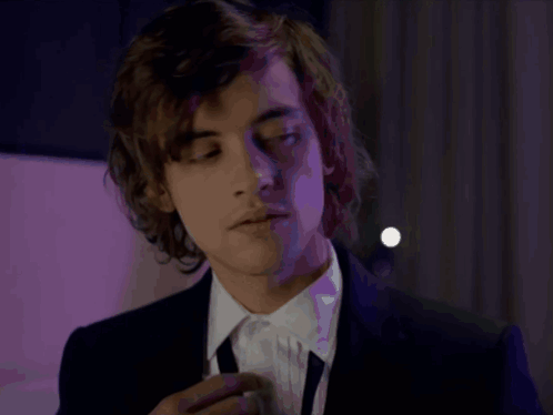 Young Man in Suit and Tie Looking