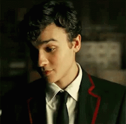 Young Man in Suit and Tie Looking at Something