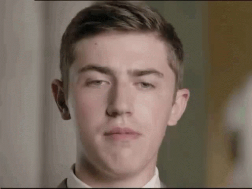 Young Man in Suit Making Face