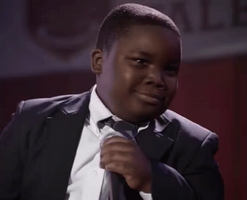 Young Man in Suit Smiling with Microphone