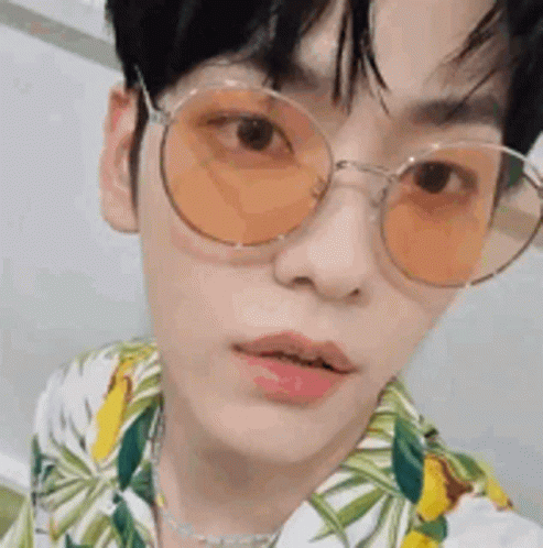 Young Man In Sunglasses And Floral Shirt GIF