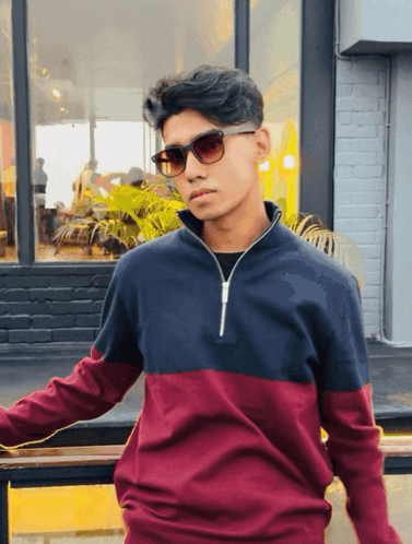 Young Man in Sunglasses and Maroon Sweater
