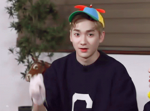 Young Man in Sweater With Letter C Holding Stuffed Animal