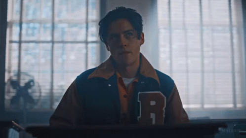 Young Man In Varsity Jacket With Letter R GIF