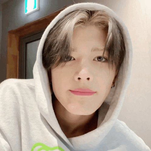 Young Man In White Hoodie With Green Heart GIF