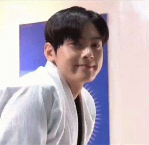 Young Man in White Karate Uniform Making a Face