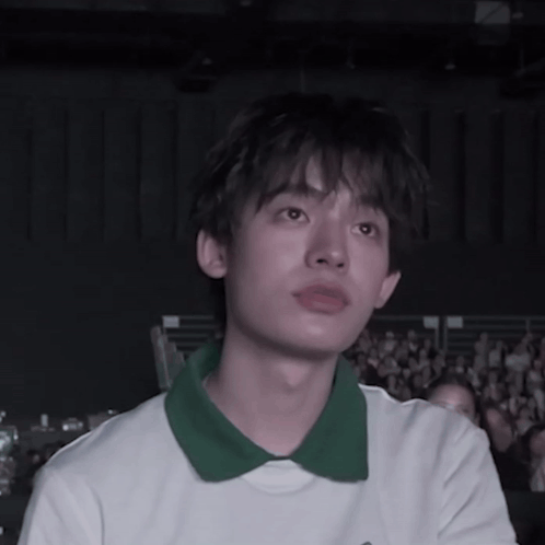 Young Man in White Shirt and Green Collar