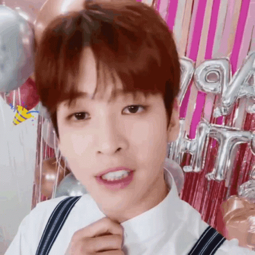 Young Man in White Shirt and Suspenders
