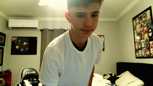 Young Man In White Shirt In Bedroom GIF