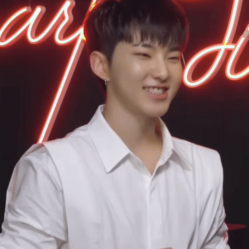 Young Man in White Shirt Smiling Neon Adore