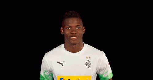 Young Man In White Shirt With Yellow Postbank Logo GIF