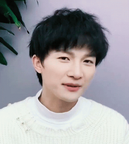 Young Man in White Sweater Close Up