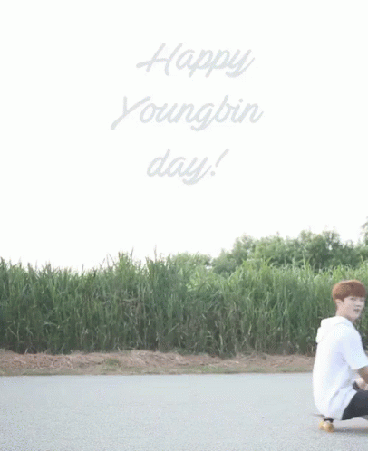 Young Man Kneeling on Skateboard Saying Happy Youngbin Day