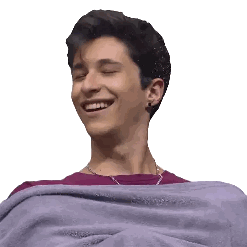 Young Man Laughing in Purple Blanket