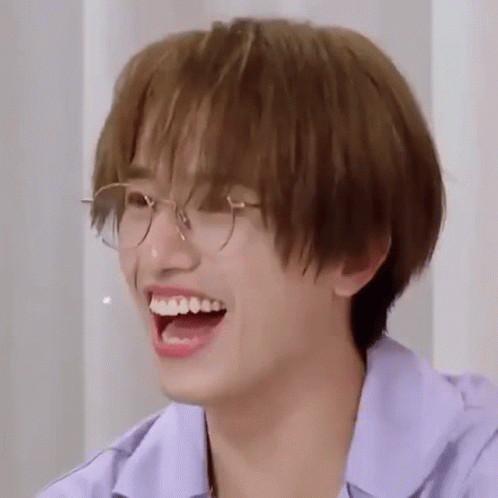 Young Man Laughing in Purple Shirt
