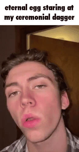 Young Man Making Funny Face With Eternal Egg Caption GIF