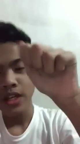 Young Man Making Funny Face With Fist Up