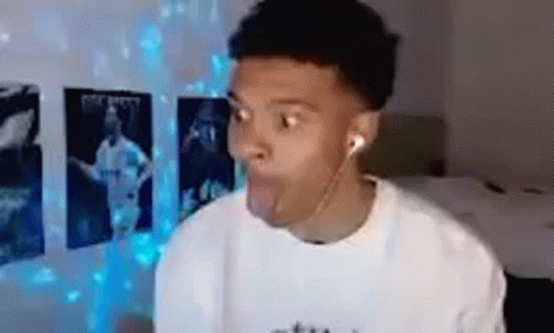 Young Man Making Funny Face with Headphones