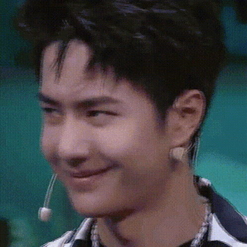 Young Man Making Funny Face With Microphone GIF