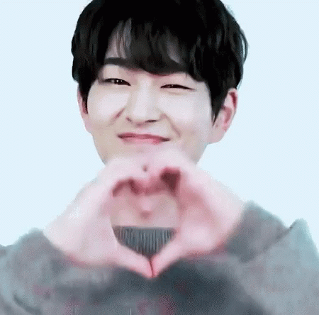 Young Man Making Heart Hands