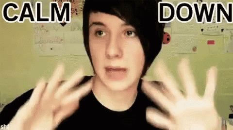 Young Man Making Peace Sign in Black Shirt