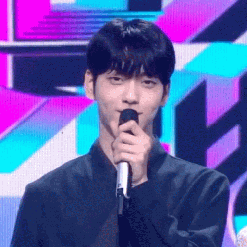 Young Man on Stage With Colorful Background
