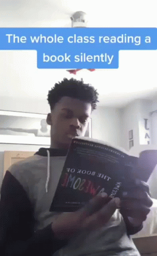 Young Man Reading Whole Class Book Silently GIF