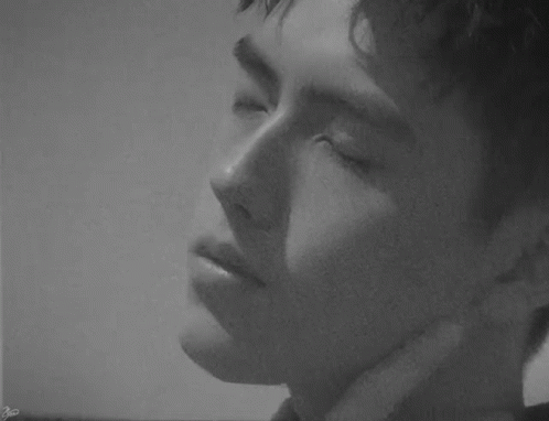 Young Man's Face with G Letter