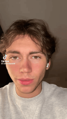 Young Man's Face With TikTok Sticker GIF