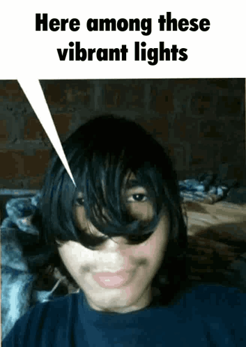 Young Man Saying Here Among Vibrant Lights GIF