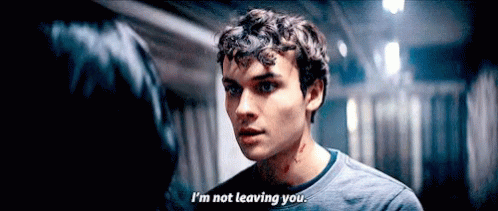Young Man Says I'm Not Leaving You to Woman in Dark Hallway