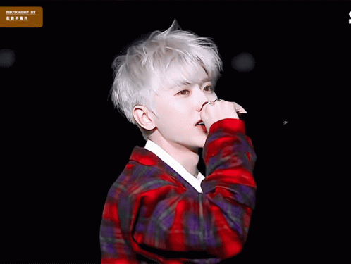 Young Man Singing Into Microphone